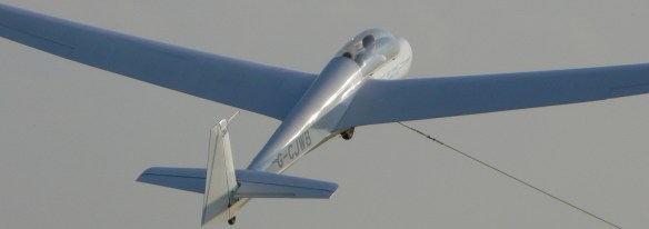 A glider being winch launched.