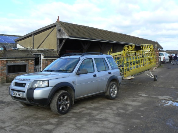 Landrover Freelander with aircraft on tow hook.