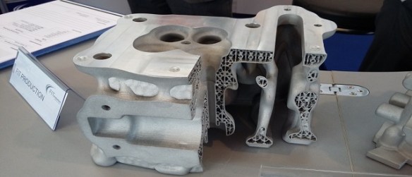 Rapid prototyping of a cylinder head giving approx.9 times the cooling area and 60% weight saving compared with the conventional cast head below