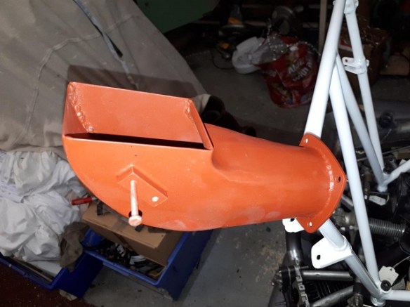 Engine inlet duct painted in orange primer.