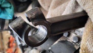 The small-end of a conrod.